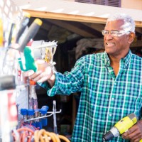 senior black man in tool shed - home decoration stock pictures, royalty-free photos & images