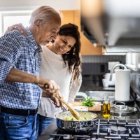 senior couple cooking in kitchen - food stock pictures, royalty-free photos & images