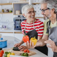 senior couple cooking together at home - food stock pictures, royalty-free photos & images