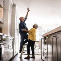 senior couple couple doing diy project at home - home decoration stock pictures, royalty-free photos & images