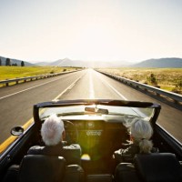 senior couple driving convertible car at sunrise - travel stock pictures, royalty-free photos & images