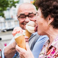 senior couple enjoy eating ice cream together - food stock pictures, royalty-free photos & images