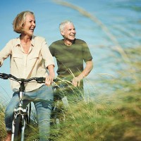 senior couple enjoying day out on their bicycles - travel stock pictures, royalty-free photos & images