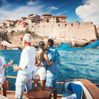 senior couple on a sailing cruise looking at coastline. - travel stock pictures, royalty-free photos & images
