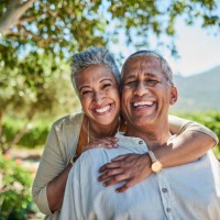 senior couple, smile and outdoor in nature park showing love, care and happy on a retirement holiday on summer day. portrait of elderly man and woman together for fresh air and tree view on vacation - travel stock pictures, r