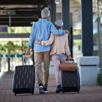 senior couple walking together on public transport station - travel stock pictures, royalty-free photos & images