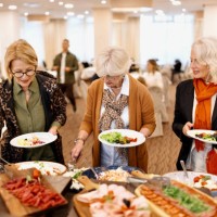 senior friends enjoying breakfast buffet at the hotel or restaurant - food stock pictures, royalty-free photos & images