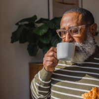 senior hipster man drinking coffee in cup at home - coffee stock pictures, royalty-free photos & images
