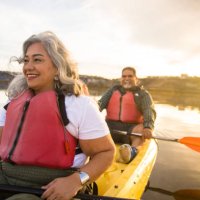 senior hispanic couple kayaking - travel stock pictures, royalty-free photos & images