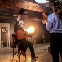 senior male guitarist on the stage of theatre - concert stock pictures, royalty-free photos & images