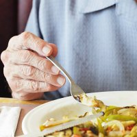 senior man fingers holding breakfast fork close-up - food stock pictures, royalty-free photos & images