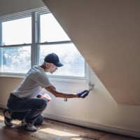 senior man painting apartment interior - home decoration stock pictures, royalty-free photos & images