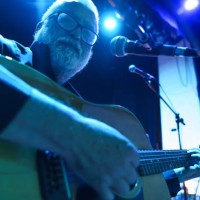 senior man playing guitar on stage during a concert - concert stock pictures, royalty-free photos & images