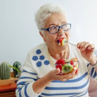 senior woman at home - food stock pictures, royalty-free photos & images