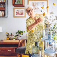 senior woman at home - home decoration stock pictures, royalty-free photos & images