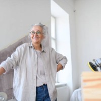 senior woman having break during reconstructing her apartment. - home decoration stock pictures, royalty-free photos & images
