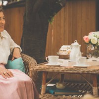 senior woman having tea in the garden - garden decoration stock pictures, royalty-free photos & images