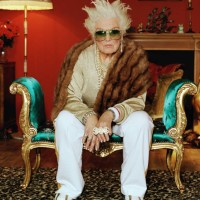 senior woman on chaise longue, wearing hip hop accessories, portrait - fashion stock pictures, royalty-free photos & images