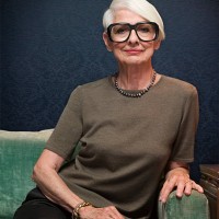 senior woman sitting on sofa wearing oversized glasses, portrait - fashion stock pictures, royalty-free photos & images