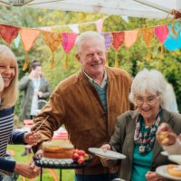 seniors enjoying cake - garden decoration stock pictures, royalty-free photos & images