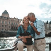 seniors taking a break in paris relaxing by the seine river in paris - travel stock pictures, royalty-free photos & images