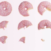 sequence of bites taken from pink donut - food stock pictures, royalty-free photos & images
