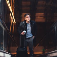 serious businessman riding escalator at subway station - junk food stock pictures, royalty-free photos & images