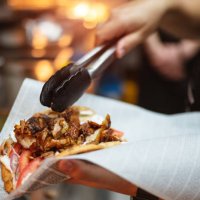 service worker preparing gyros pita - junk food stock pictures, royalty-free photos & images