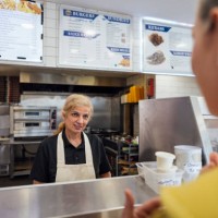 serving customer at chip shop - junk food stock pictures, royalty-free photos & images