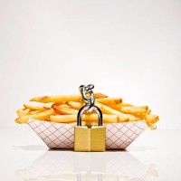 serving of french fries with lock around them - junk food stock pictures, royalty-free photos & images