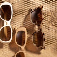 set of fashion collection sunglasses - horn rim sunglasses on abstract geometric background made of brown wrapping paper with sunlight. - fashion stock pictures, royalty-free photos & images