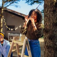 setting light bulb decor in outdoor party - garden decoration stock pictures, royalty-free photos & images