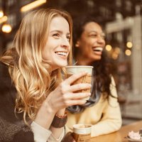 sharing a laugh with my friend - coffee stockfoto's en -beelden