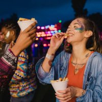 sharing chips at a festival - food stock pictures, royalty-free photos & images