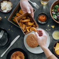 sharing takeaway fast-food meal - junk food stock pictures, royalty-free photos & images