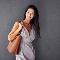 she's packing a purse and a smile - fashion stock pictures, royalty-free photos & images