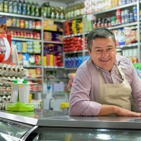 shopkeeper at a local food shop - food stock pictures, royalty-free photos & images
