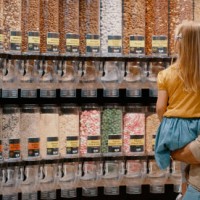 shopping, choice and father with child choosing snacks and food in a grocery supermarket. retail store, shop and dad and daughter picking candy, sweet or nuts for nutrition and diet to buy - junk food stock pictures, royalty-