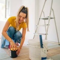 shot of a beautiful young woman painter prepares paint for painting - home decoration stock pictures, royalty-free photos & images
