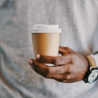 shot of a businessman holding a cup of coffee - junk food stock pictures, royalty-free photos & images