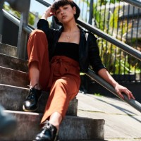 shot of a stylish young woman sitting outside on a staircase - fashion stock pictures, royalty-free photos & images