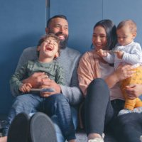 shot of a young couple sitting with their two sons in a room undergoing renovations - home decoration stock pictures, royalty-free photos & images