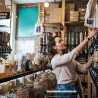 shot of a young woman filling a jar with product while shopping - home decoration stock pictures, royalty-free photos & images