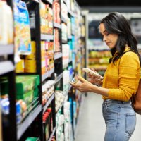 shot of a young woman shopping for groceries in a supermarket - food stock pictures, royalty-free photos & images