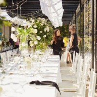 shot of two masked young women decorating a wedding venue together - garden decoration stock pictures, royalty-free photos & images