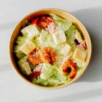 shrimp salad. healthy seafood caesar salad with prawns on white background. top view - junk food stock pictures, royalty-free photos & images