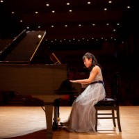 side view of teenage girl playing the piano in concert hall - concert stock pictures, royalty-free photos & images