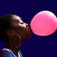 side view of young woman blowing balloon - food stock pictures, royalty-free photos & images
