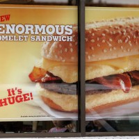 Sign hangs in a window for Burger King's new 