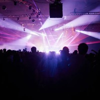 silhouette crowd facing stage at music festival - concert stock-fotos und bilder